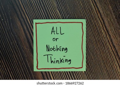 All Or Nothing Thinking Write On Sticky Notes Isolated On Wooden Table.