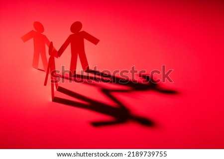 all in one link of three both hand down paper figure on red light background. in concept of business, teamwork and critical