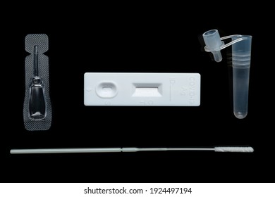 All Parts Of Sars-cov-2 Rapid Antigen Test Kit On Black Surface Flat Lay