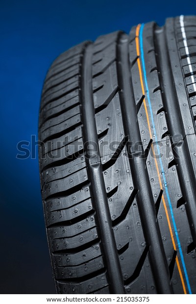 all season car tire on\
blue background