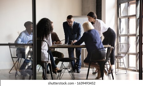 All Staff Involved In Corporate Task Search Solution, Six Multiethnic Professionals Gathered At Board Room Analyzing Data, Brainstorming Share Thoughts Ideas During Group Meeting, Having Busy Workday