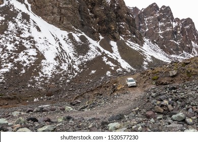 All Terrain Drive Adventure At Andes Mountains, A Remote Place For An Awesome Outdoor Experience On A Wild Environment. A Jeep Moving Around Andes Valleys Dirt Roads Avoiding The Natural Obstacles 