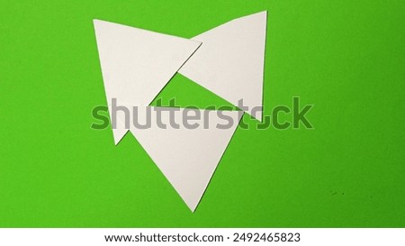 All three paper triangles are merged between by their corners