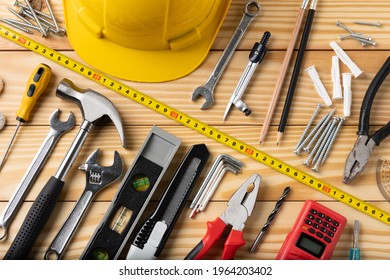 All tools supplies home construction on the wooden table background. Building tool repair equipments.