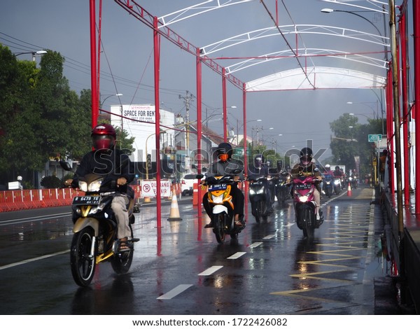 All types of motorists who enter the city of\
Purwokerto pass through the disinfectant spraying room to prevent\
the corona virus or Covid-19. Purwokerto, Central Java, Indonesia.\
May 2, 2020