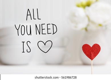 All You Need IS Love message with small red heart with white dishes