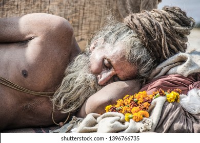 Allahabad, India- January 31 2019: Portrait of a sadhu sleeping at the city of Allahabad, India. Sadhu is a holy man, who have chosen to live an ascetic life.
