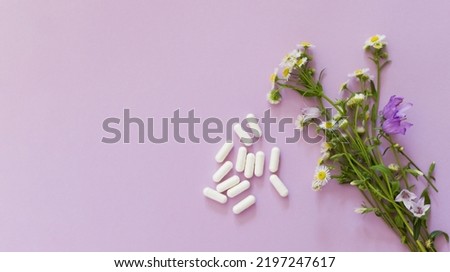 Allegry concept, flowers and pills on a pink background with copy space Stock photo © 