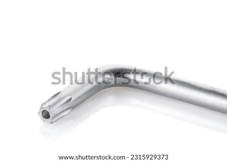 Allen star key, isolated on white background, steel carbon hand tool, chrome wrench. Tool for mechanic. Closeup.