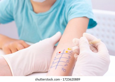 Allergen test on hand. child undergoing procedure of allergen skin test in clinic.