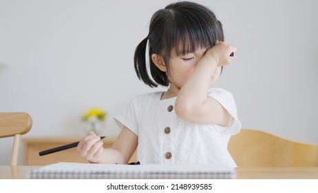 Allergic child rubbing eyes in the room - Powered by Shutterstock