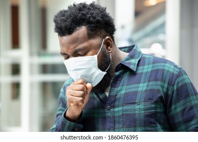 Allergic Sick Black African Man Coughing With Sore Throat; Concept Of African Man With Allergy, Pneumonia, Sore Throat, Influenza, Flu, Cold, COVID-19 Coronavirus, Social Distancing Concept
