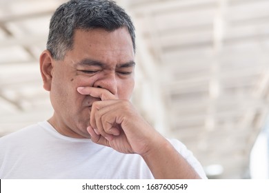 Allergic Sick Old Man Wiping His Runny Nose And Touching His Face; Concept Of Man With Coronavirus Covid-19 Infection Disease, Allergy, Lung Inflammation, Pneumonia, Influenza, Flu, Cold, Sickness