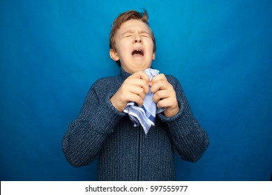 Allergy Boy Child With Runny Nose Holding A Handkerchief