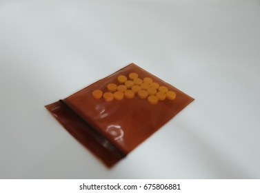 Allergy Pill In Opaque Bag On White Background