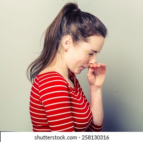 Allergy Sneeze Young Woman Scratch Nose In Fashion Stripes Clothes Hipster Casual Posing On Light Background  