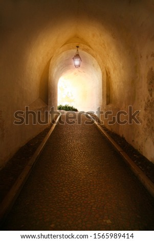 alley with light in castle in Lisabon, Portugal