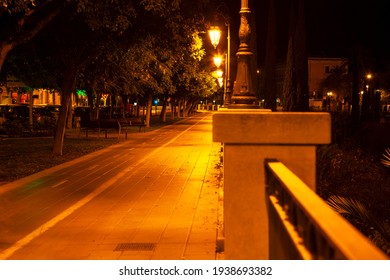 Alley with pavement in the night illumination . Nighttime promenade  - Shutterstock ID 1938693382
