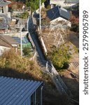 An alley winding through a mountainside village.
A landscape of a rural Japanese residential area.