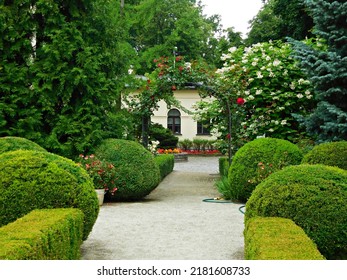 Alleys with flower beds in the garden at the Herbst Palace in Łódź, Poland