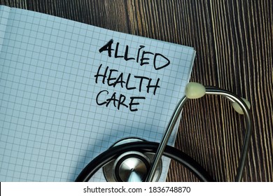 Allied Health Care write on a book isolated on Wooden Table. - Shutterstock ID 1836748870
