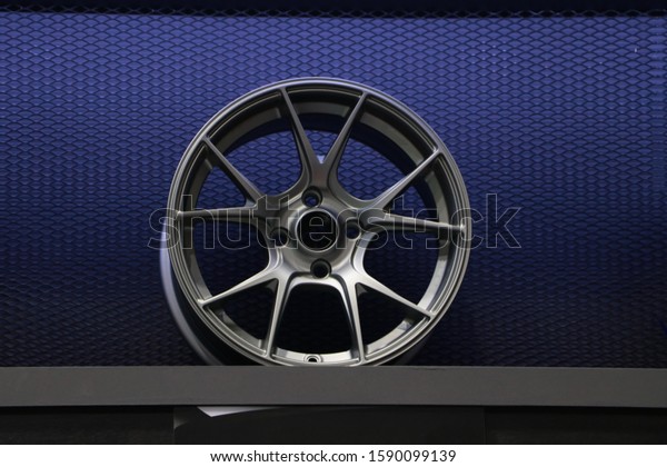 Alloy Wheel of car on the\
shelf. Alloy wheels are wheels that are made from an alloy of\
aluminium or magnesium. Alloys are mixtures of a metal and other\
elements.