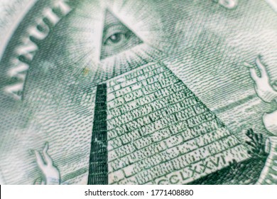 All-seeing eye on US one dollar bill closeup macro with Soft Focus on a pyramid. 
