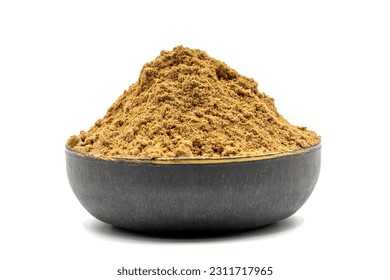 Allspice spice powder isolated on white background. Powdered dried allspice in bowl. Pimento spice, Jamaican pepper and shavings