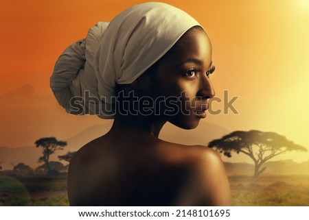 The allure of africa. Cropped shot of a beautiful woman standing against the backdrop of an african sunset.