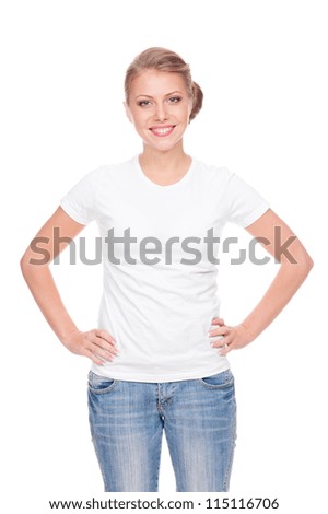 alluring young woman in the white t-shirt and blue jeans standing over white background