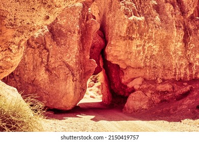 Almaty, Kazachstan - June 16 2017 : Red Sandstone Rocks Keep A Little Bit Of Space So A River Or Car Is Able To Pass Through