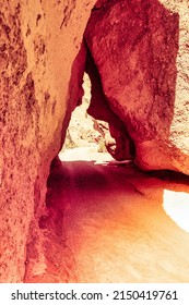 Almaty, Kazachstan - June 16 2017 : Red Sandstone Rocks Keep A Little Bit Of Space So A River Or Car Is Able To Pass Through