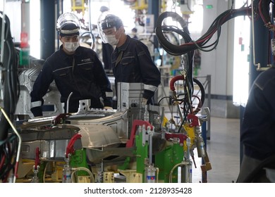 Almaty, Kazakhstan - 02.15.2022 : Workers Install And Solder Together Different Parts Of The Car. Hyundai Factory