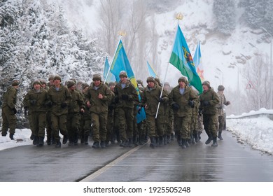 Almaty, Kazakhstan - 02.25.2021 : Military exercises of various troops. Soldiers with flags lined up before the uphill race.