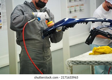 Almaty, Kazakhstan - 03.29.2022 : Workers Paint And Polish The Exterior Of The Car. Hyundai Factory 
