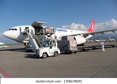 
Almaty / Kazakhstan - 04.18.2020 : Airport Staff And Medics Unload Humanitarian Cargo Turkish Cargo