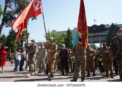 Almaty, Kazakhstan - 05.09.2021 : Veterans Of The War In Afghanistan, Carry Flags To The Victory Memorial And The Eternal Flame