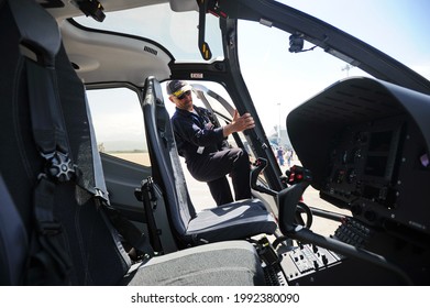 Almaty, Kazakhstan - 06.11.2016 : The helicopter pilot is preparing to take off from the airport. - Shutterstock ID 1992380090
