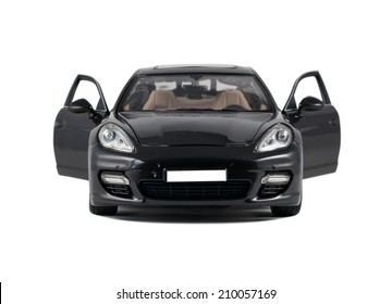 Almaty, Kazakhstan - 10 March 2014: Collectible toy car Porsche Panamera Turbo front view with open door on a white background