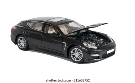 Almaty, Kazakhstan - 10 March 2014: Collectible toy car Porsche Panamera Turbo with open hood on a white background