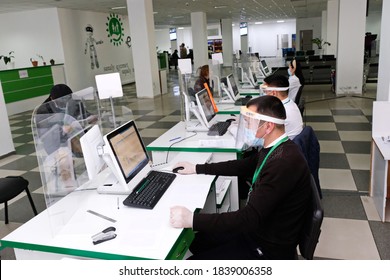 Almaty / Kazakhstan - 10.19.2020 : Citizen Service Center. A Government Employee Wearing A Mask And Gloves Works During Quarantine.