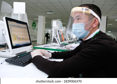 Almaty / Kazakhstan - 10.19.2020 : Citizen Service Center. A Government Employee Wearing A Mask And Gloves Works During Quarantine.