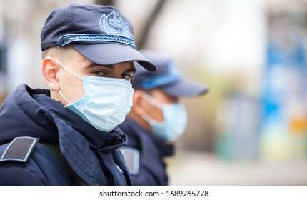 Almaty, Kazakhstan 31/03/2020:handsome Military Russian Policeman Stands On The Street In An Antiviral Mask During A Coronavirus