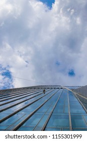 Almaty / Kazakhstan - Apr 2016: Alain Robert, French Climber Widely Known As Spiderman, Climbed Up One Of The Tallest Buildings In The City.