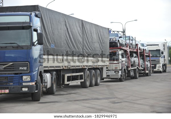Almaty region /\
Kazakhstan - 05.25.2012 : A truck with several cars for sale.\
Customs post at the\
border.