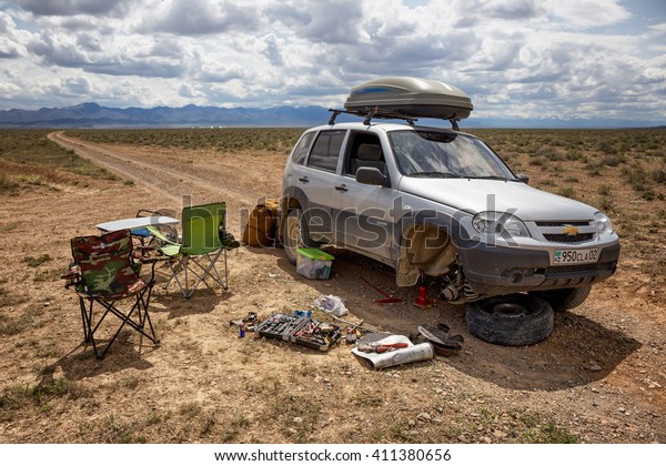 ALMATY REGION , KAZAKHSTAN - APR 23, 2016:\
The car  broke down on rural road in deserts  of National park\
Charyn,  Kazakhstan\
