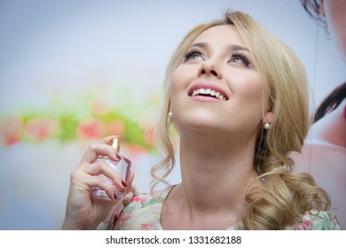 Almaty/Kazakhstan - January 19 2017: Beautiful Caucasian Girl Posing With The Avon Viva La Vita Eau De Parfum. Avon Sales Conference.