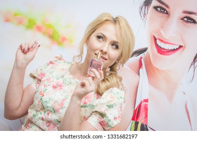 Almaty/Kazakhstan - January 19 2017: Beautiful Caucasian Girl Posing With The Avon Viva La Vita Eau De Parfum. Avon Sales Conference.