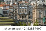 Almeida Garret Square with the Sao Bento railway station and Congregados Church at the back timelapse, Porto, Portugal. Traffic on intersection in front of the building