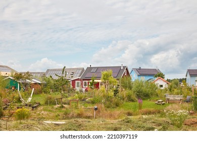 Almere, The Netherlands - July 14, 2022: New Dutch Wooden Based Tiny Houses With Community Garden In The City Of Almere, The Netherlands